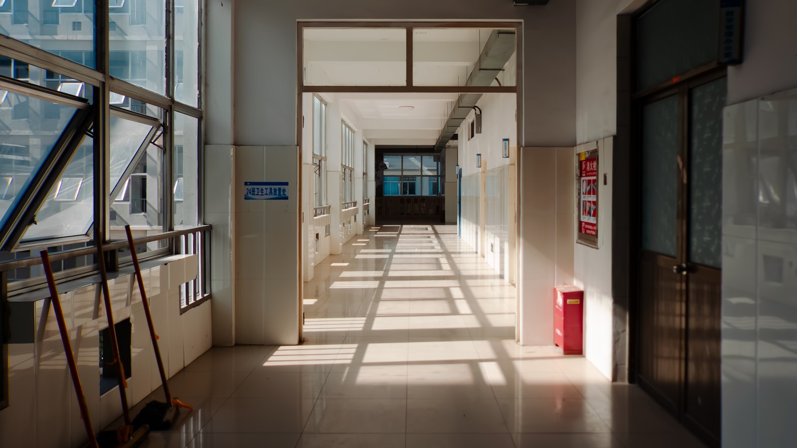 A long institutional corridor lit from one side