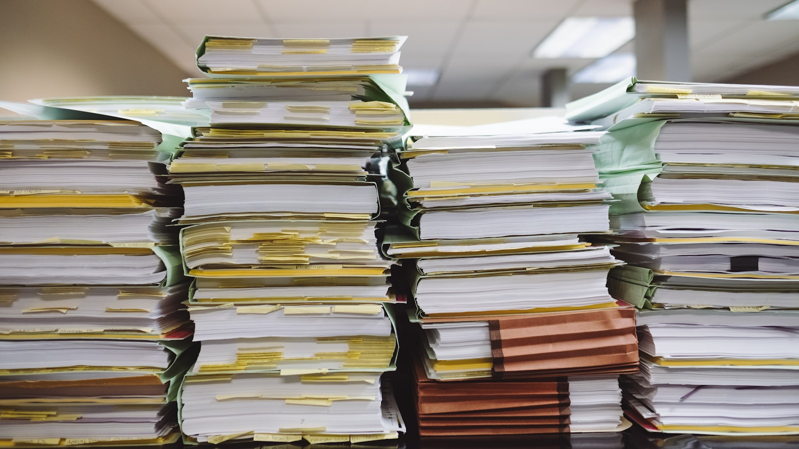 Stacks of paper files and folders