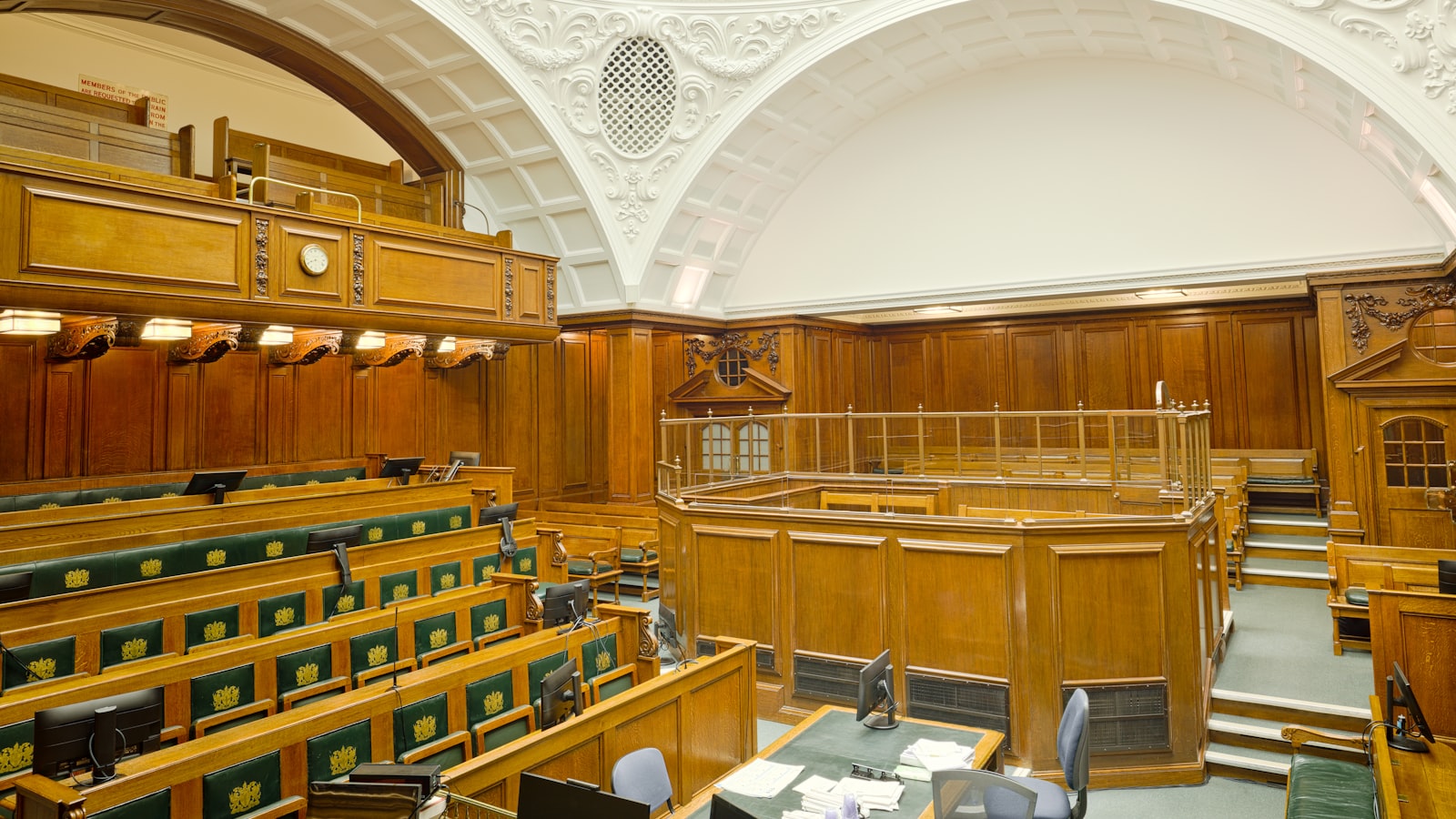 The empty wooden interior of a courtroom