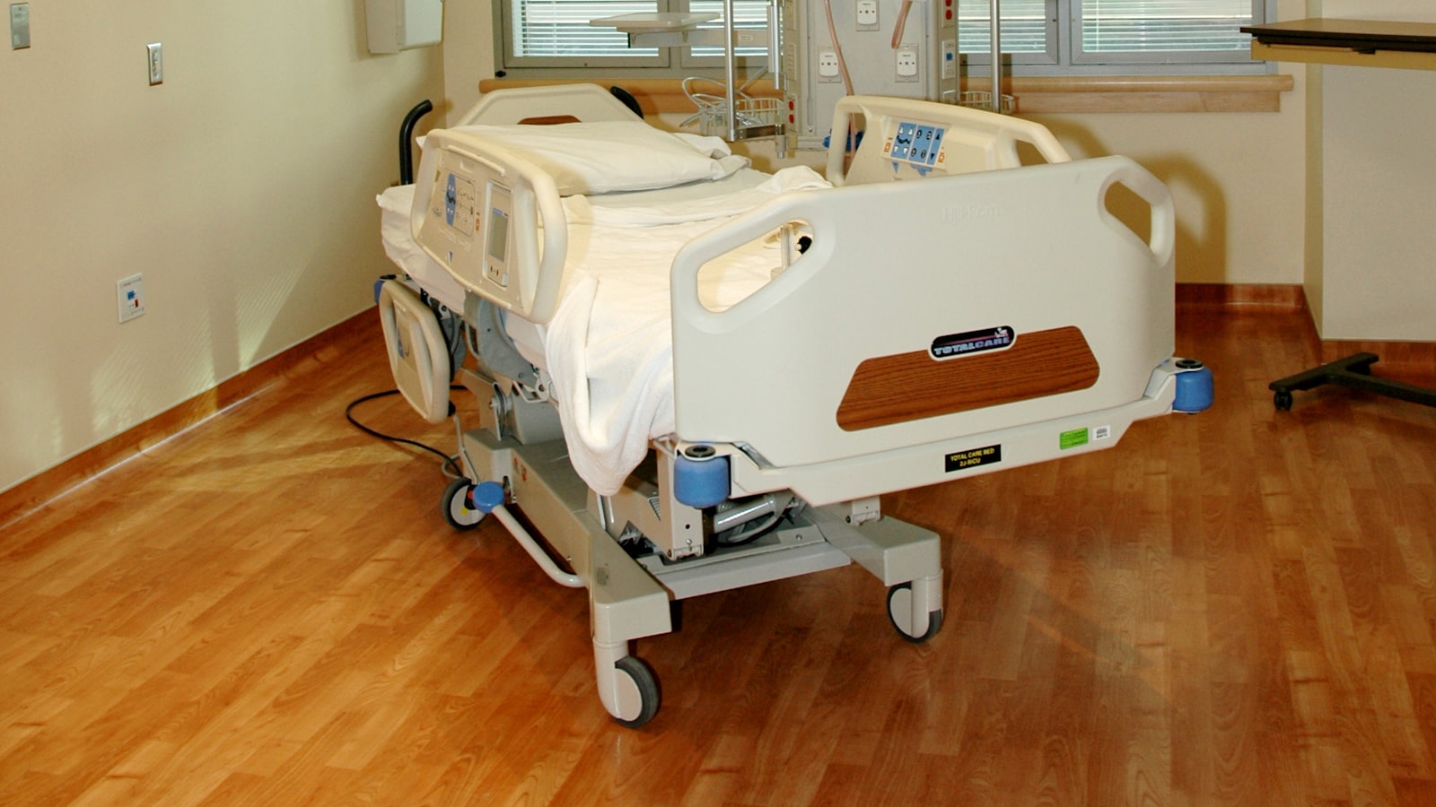 An adjustable care bed set up in a room at home