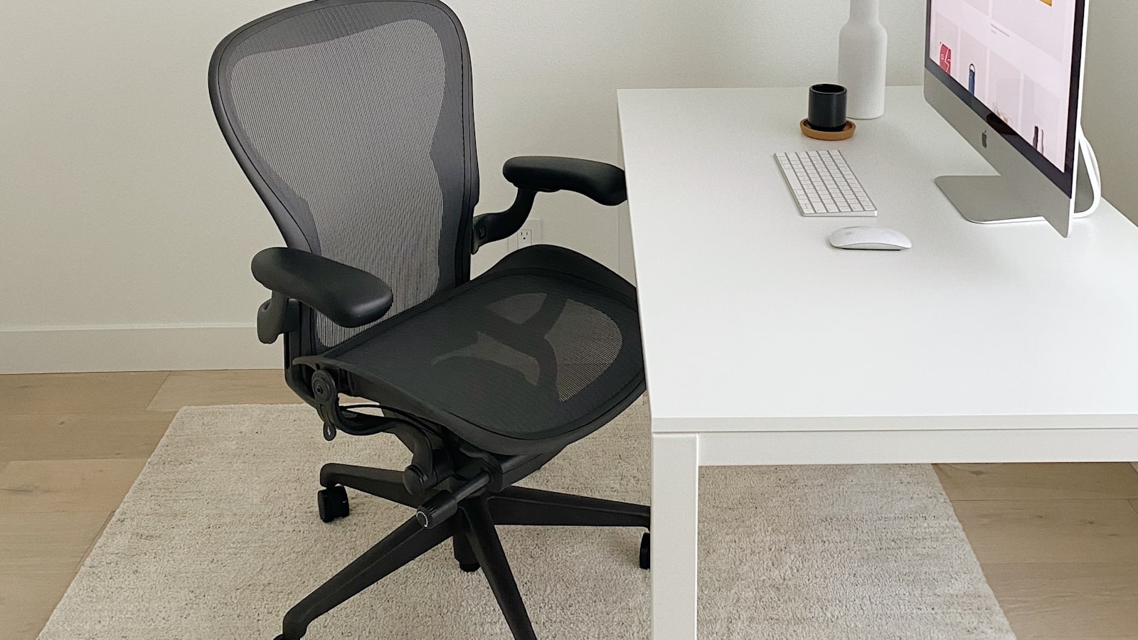 An empty desk and office chair